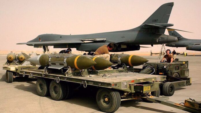 This handout image shows u.s. forces loading 2000-pound bombs and “bunker buster” bombs onto a B-1 bomber. (Photo by Getty Images)