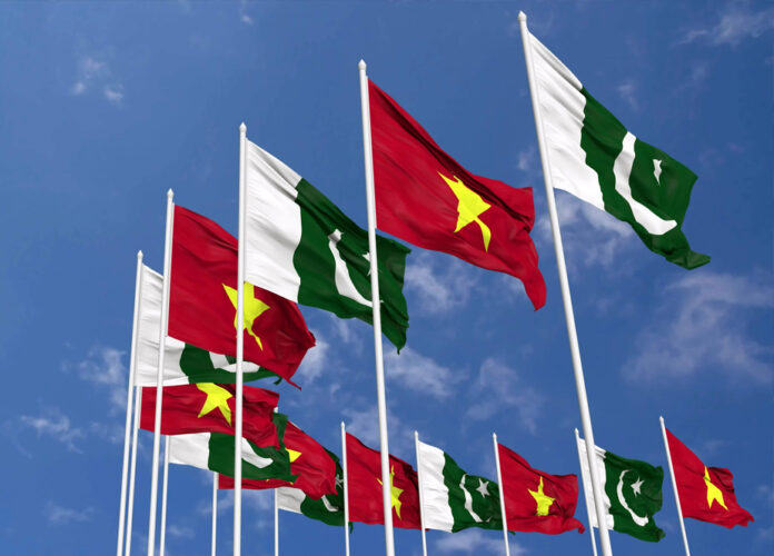 Pakistan and Vietnam Flags Waving Together
